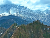 The snowy mountains are rising and falling in the Qilian Mountains National Park's horseshoe scenic area in Zhangye, China, on April 4, 2024...