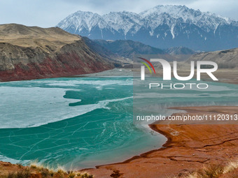 The snowy mountains are rising and falling in the Qilian Mountains National Park's horseshoe scenic area in Zhangye, China, on April 4, 2024...