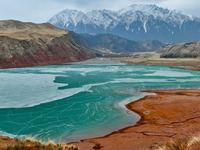 The snowy mountains are rising and falling in the Qilian Mountains National Park's horseshoe scenic area in Zhangye, China, on April 4, 2024...