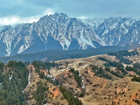 The snowy mountains are rising and falling in the Qilian Mountains National Park's horseshoe scenic area in Zhangye, China, on April 4, 2024...