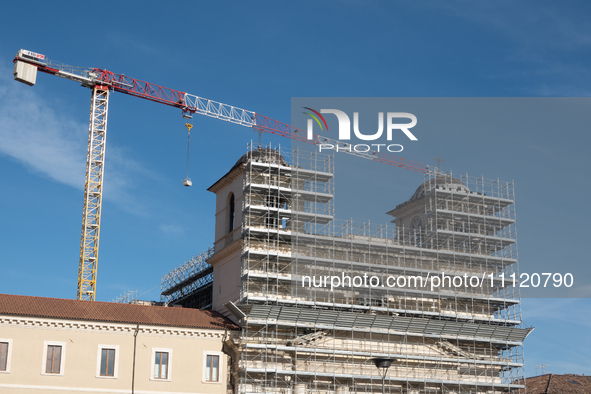 A building site and a crane on Saints Massimo and George Cathedral is seen in L'Aquila, Italy, on April 5th, 2024. on April 6th L'Aquila wil...