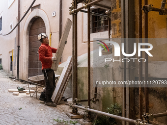 A worker on a building site and rebuilt buildings are seen in L'Aquila, Italy, on April 5th, 2024. on April 6th L'Aquila will commemorate it...