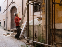 A worker on a building site and rebuilt buildings are seen in L'Aquila, Italy, on April 5th, 2024. on April 6th L'Aquila will commemorate it...