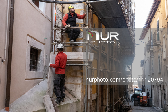 Workers on a building site and rebuilt buildings are seen in L'Aquila, Italy, on April 5th, 2024. on April 6th L'Aquila will commemorate its...