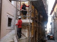 Workers on a building site and rebuilt buildings are seen in L'Aquila, Italy, on April 5th, 2024. on April 6th L'Aquila will commemorate its...