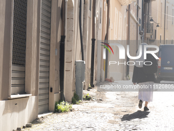 A nun walking around historic centre is seen in L'Aquila, Italy, on April 5th, 2024. on April 6th L'Aquila will commemorate its 15th anniver...