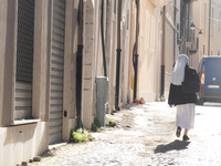 A nun walking around historic centre is seen in L'Aquila, Italy, on April 5th, 2024. on April 6th L'Aquila will commemorate its 15th anniver...