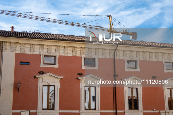 A rebuilt building and a crane are seen in L'Aquila, Italy, on April 5th, 2024. On April 6th L'Aquila will commemorate its 15th anniversary...