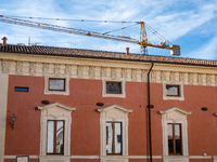 A rebuilt building and a crane are seen in L'Aquila, Italy, on April 5th, 2024. On April 6th L'Aquila will commemorate its 15th anniversary...