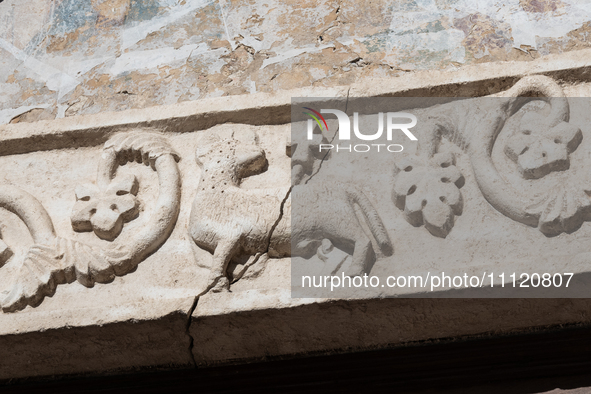 A damaged Holy Lamb is seen on a church facade in L'Aquila, Italy, on April 5th, 2024. on April 6th L'Aquila will commemorate its 15th anniv...