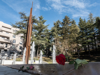 A red rose laid in Memorial Park is seen in L'Aquila, Italy, on April 5th, 2024. On April 6th L'Aquila will commemorate its 15th anniversary...