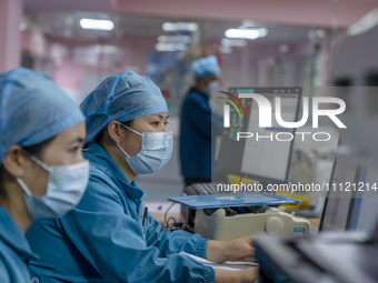 Doctors and nurses are providing medical services to seriously ill patients in an intensive care unit in Enshi, Hubei Province, China, on Ap...