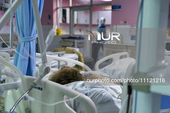 Patients are lying with tubes in an intensive care unit in Enshi, Hubei Province, China, on April 5, 2024. 