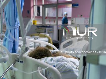 Patients are lying with tubes in an intensive care unit in Enshi, Hubei Province, China, on April 5, 2024. (