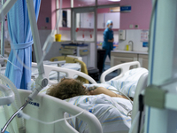 Patients are lying with tubes in an intensive care unit in Enshi, Hubei Province, China, on April 5, 2024. (