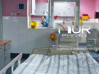 A nurse is dispensing medicine in an intensive care room in Enshi, Hubei Province, China, on April 5, 2024. (