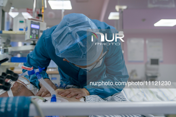 Doctors and nurses are providing medical services to seriously ill patients in an intensive care unit in Enshi, Hubei Province, China, on Ap...