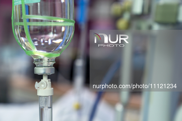 A glass salt-bottle intravenous infusion device is being seen in an intensive care unit in Enshi, Hubei Province, China, on April 5, 2024. 