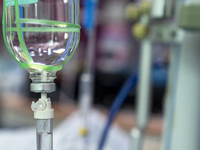 A glass salt-bottle intravenous infusion device is being seen in an intensive care unit in Enshi, Hubei Province, China, on April 5, 2024. (