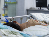 Patients are lying with tubes in an intensive care unit in Enshi, Hubei Province, China, on April 5, 2024. (