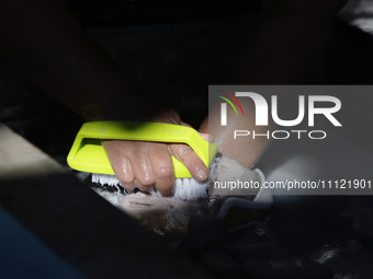 A woman is washing clothes at a community laundry in Santa Cruz Acalpixca, Xochimilco, Mexico City. (