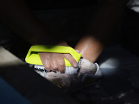 A woman is washing clothes at a community laundry in Santa Cruz Acalpixca, Xochimilco, Mexico City. (