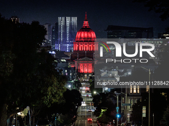 City Hall is being illuminated in red for World TB Day in San Francisco, California, on March 24, 2024. Earlier in March, California voters...