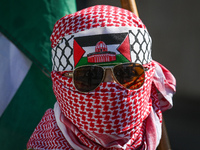 EDMONTON, CANADA - APRIL 07:
A young member of the Palestinian diaspora wearing Keffiyeh seen during the 'Stop Genocide Rally' at Violet Kin...