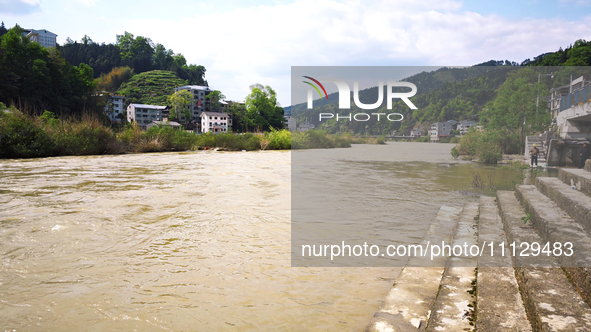 The water level of the Liangjiang River is rising after heavy rains in Datong Township, Qiandongnan County, Guizhou Province, China, on Apri...