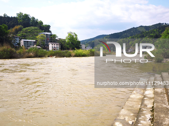 The water level of the Liangjiang River is rising after heavy rains in Datong Township, Qiandongnan County, Guizhou Province, China, on Apri...