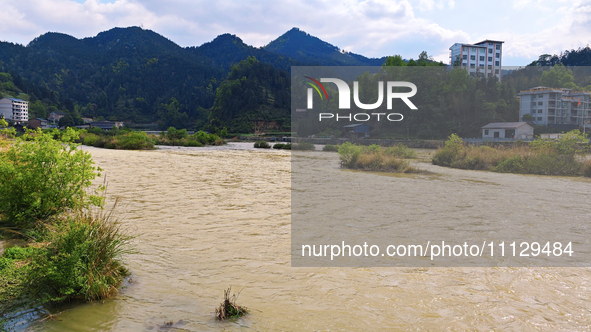 The water level of the Liangjiang River is rising after heavy rains in Datong Township, Qiandongnan County, Guizhou Province, China, on Apri...