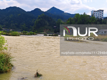 The water level of the Liangjiang River is rising after heavy rains in Datong Township, Qiandongnan County, Guizhou Province, China, on Apri...