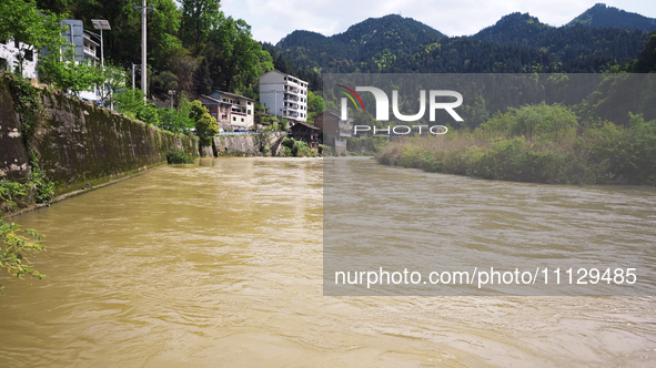 The water level of the Liangjiang River is rising after heavy rains in Datong Township, Qiandongnan County, Guizhou Province, China, on Apri...