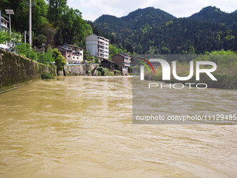 The water level of the Liangjiang River is rising after heavy rains in Datong Township, Qiandongnan County, Guizhou Province, China, on Apri...