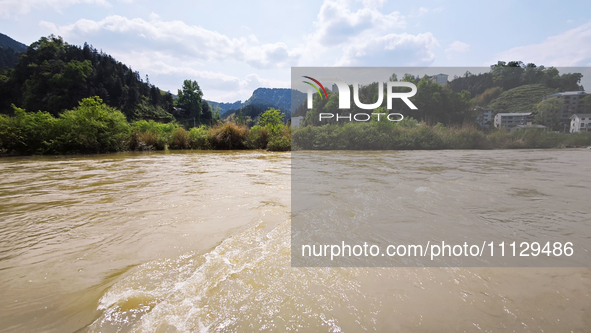 The water level of the Liangjiang River is rising after heavy rains in Datong Township, Qiandongnan County, Guizhou Province, China, on Apri...