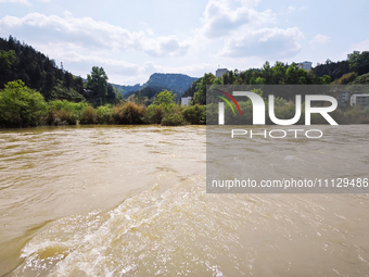 The water level of the Liangjiang River is rising after heavy rains in Datong Township, Qiandongnan County, Guizhou Province, China, on Apri...