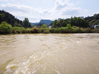 The water level of the Liangjiang River is rising after heavy rains in Datong Township, Qiandongnan County, Guizhou Province, China, on Apri...