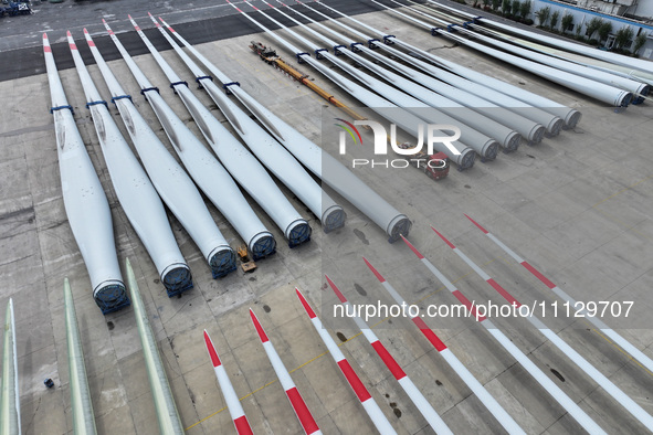 Wind turbine blades are being manufactured at a company in Yangzhou, China, on April 8, 2024. 