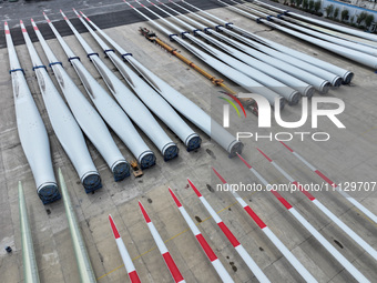 Wind turbine blades are being manufactured at a company in Yangzhou, China, on April 8, 2024. (