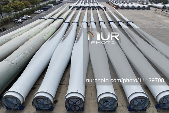 Wind turbine blades are being manufactured at a company in Yangzhou, China, on April 8, 2024. 