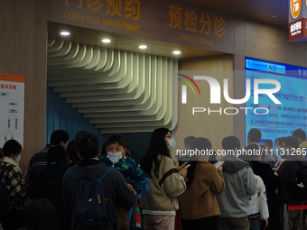 Parents are taking their children to see a doctor at a hospital in Shanghai, China, on April 9, 2024. (