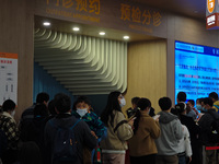 Parents are taking their children to see a doctor at a hospital in Shanghai, China, on April 9, 2024. (