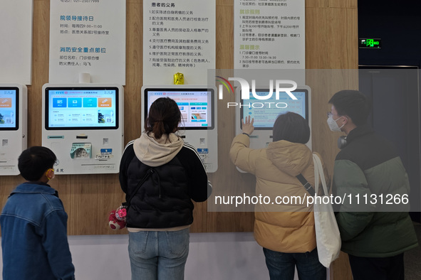 Parents are taking their children to see a doctor at a hospital in Shanghai, China, on April 9, 2024. 