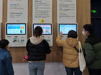 Parents are taking their children to see a doctor at a hospital in Shanghai, China, on April 9, 2024. (