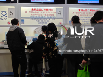 Parents are taking their children to see a doctor at a hospital in Shanghai, China, on April 9, 2024. (