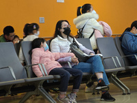 Parents are taking their children to see a doctor at a hospital in Shanghai, China, on April 9, 2024. (