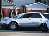 Vehicles are damaged at the crime scene where a 4-year-old boy is in critical condition after being shot in broad daylight in Chicago, Illin...