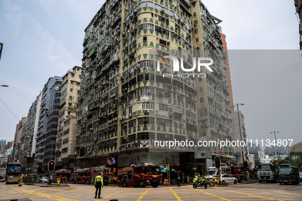 A general view is showing the building that is on fire in Hong Kong's Jordan District on April 10, 2024. The fire has resulted in 5 deaths a...