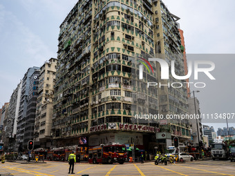 A general view is showing the building that is on fire in Hong Kong's Jordan District on April 10, 2024. The fire has resulted in 5 deaths a...