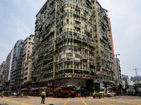 A general view is showing the building that is on fire in Hong Kong's Jordan District on April 10, 2024. The fire has resulted in 5 deaths a...